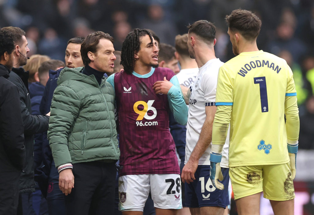 Scott Parker, Manager of Burnley and Hannibal Mejbri of Burnley react towards Andrew Hughes and Freddie Woodman of Preston North End after an incident between Hannibal Mejbri of Burnley and Milutin Osmajic of Preston North End (not pictured) during the Sky Bet Championship match between Preston North End FC and Burnley FC