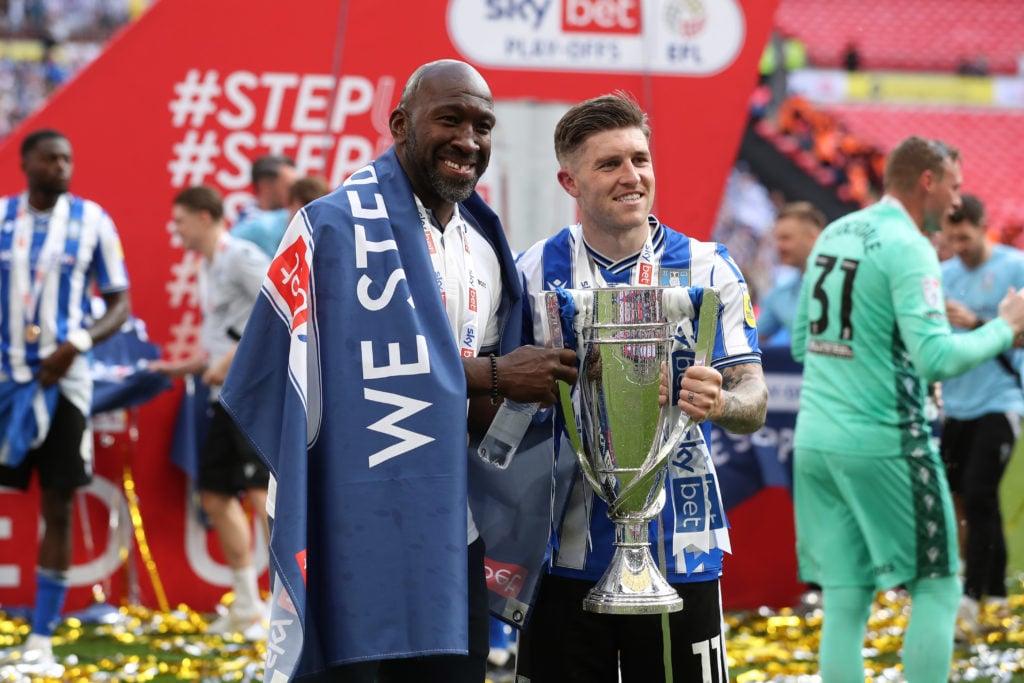 Josh Windass and Darren Moore hold League One play-off final trophy after Barnsley vs Sheffield Wednesday in Sky Bet League One Play-Off Final