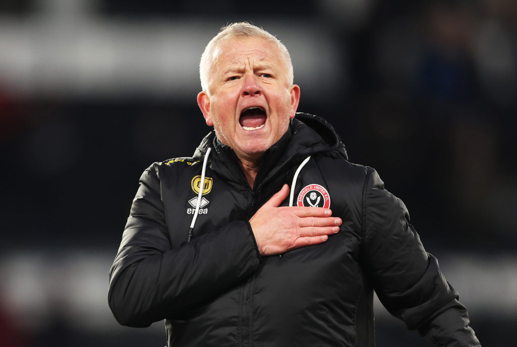 Chris Wilder touches Sheffield United FC badge