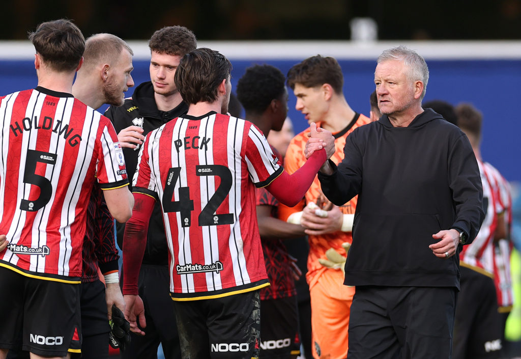 Chris Wilder, Sheffield United manager, shakes hands with Sydie Peck
