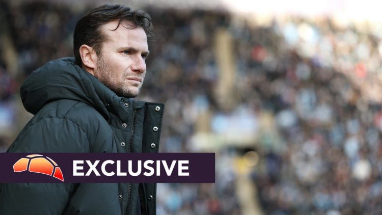 Tom Cleverley, Manager of Watford, looks on prior to the Sky Bet Championship match, with an exclusive banner.