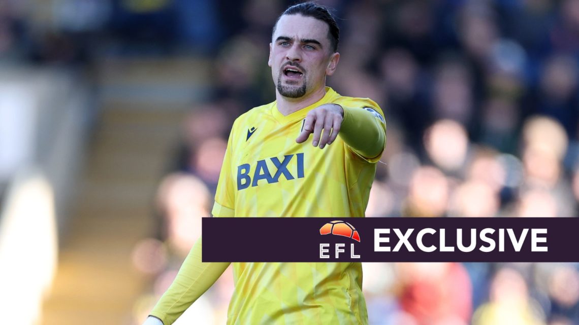 Oxford United defender Ciaron Brown points to his teammates during a Championship game