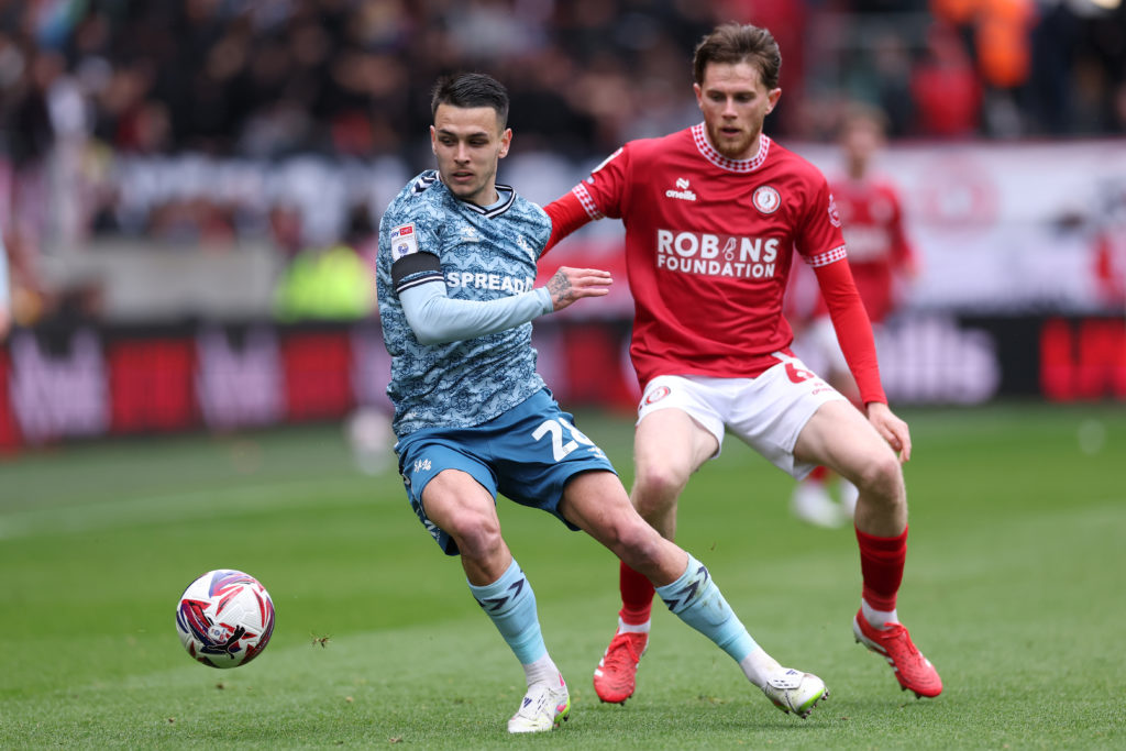 Enzo Le Fee of Sunderland runs with the ball whilst under pressure from Max Bird of Bristol City during the Sky Bet Championship match between Bristol City FC and Sunderland AFC