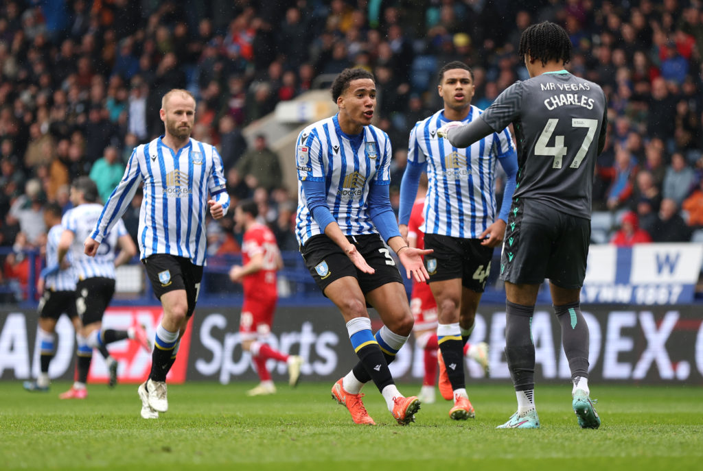 Gabriel Otegbayo celebrates with Pierce Charles during a Sheffield Wednesday game