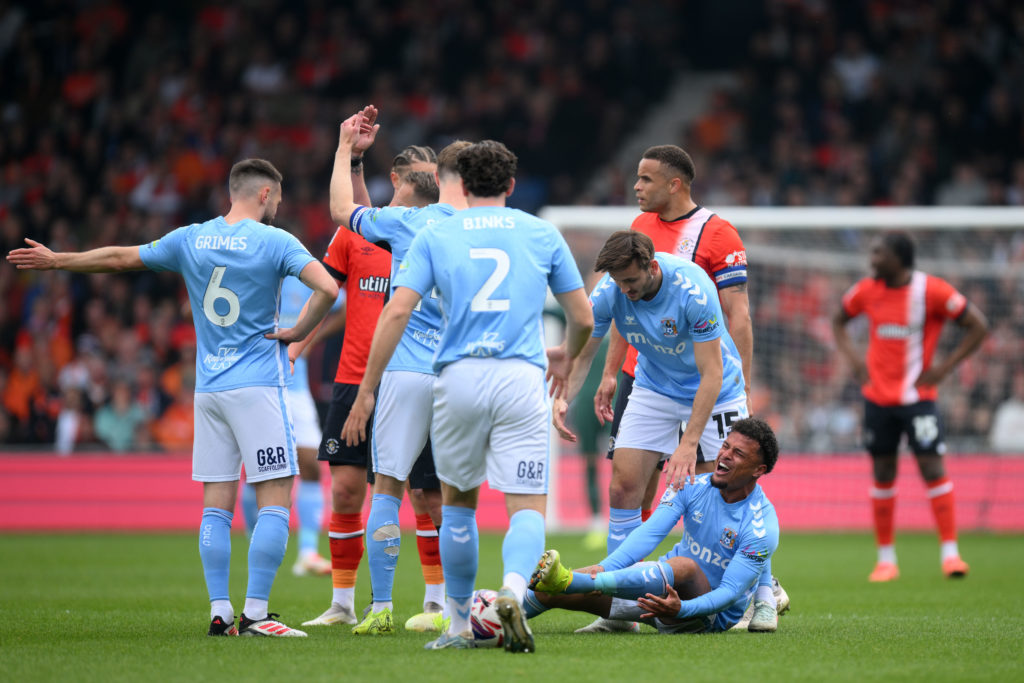 Coventry City's Joel Latibeaudiere is injured during the Sky Bet Championship match vs Luton Town