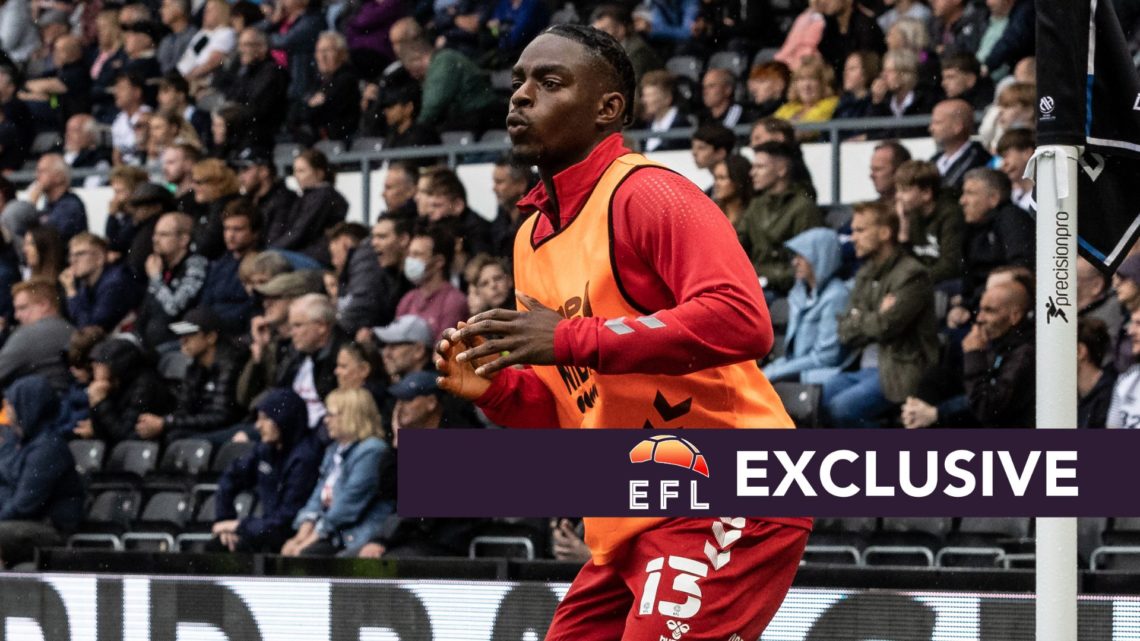 Toyosi Olusanya warms up for Middlesbrough during a Championship game.