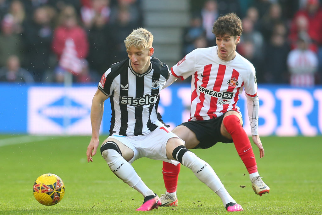 Newcastle United's Anthony Gordon and Sunderland's Trai Hume contest a challenge in the FA Cup third round at the Stadium of Light