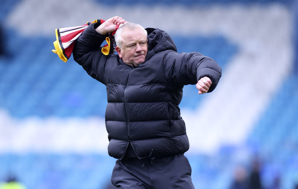 Chris Wilder celebrates with a scarf after Sheffield United beat Sheffield Wednesday