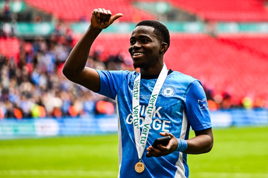 Kwame Poku (11 Peterborough United) holds a winner's medal during the Vertu Trophy Final between Birmingham City and Peterborough