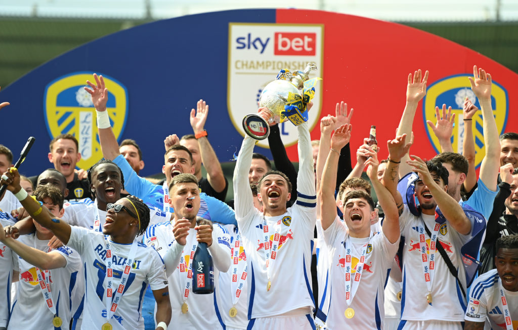 Ethan Ampadu of Leeds United celebrates with the Sky Bet Championship trophy after the teams 2-1 victory, which confirmed that the team has won the Sky Bet Championship and promotion to the Premier League following the Sky Bet Championship match between Plymouth Argyle FC and Leeds United FC