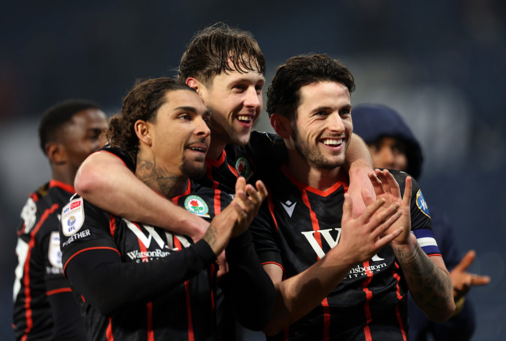 Tyrhys Dolan, Callum Brittain and Lewis Travis of Blackburn Rovers celebrate after the Sky Bet Championship match between West Bromwich Albion FC and Blackburn Rovers