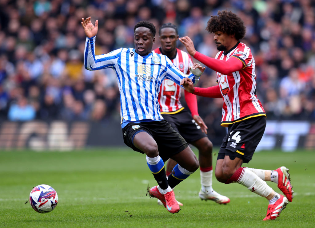 Djeidi Gassama of Sheffield Wednesday and Hamza Choudhury of Sheffield United challenge for the ball during the Steel City derby
