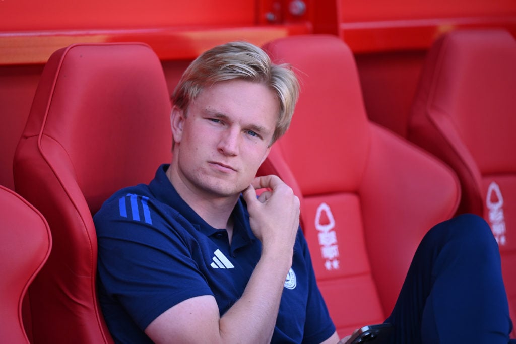 Victor Kristiansen looks on from the bench before Leicester City's game against Nottingham Forest