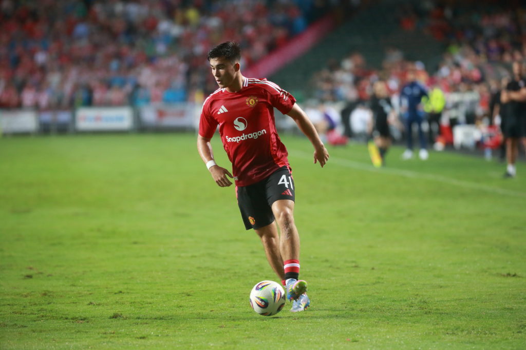 Harry Amass on the ball for Manchester United during a friendly match