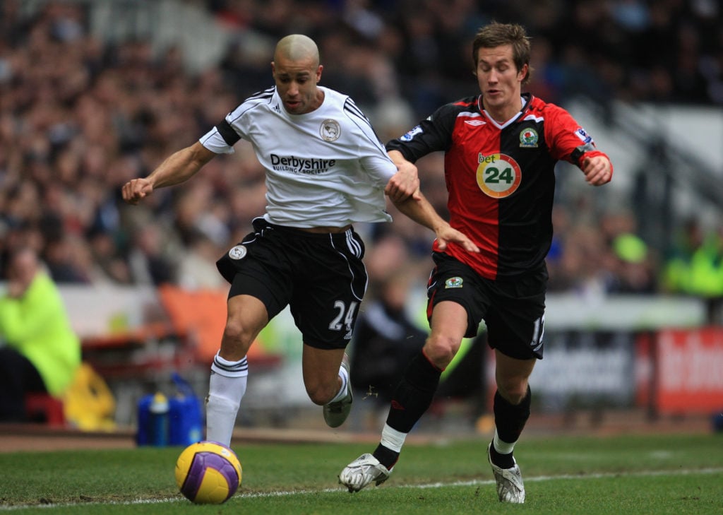 Tyrone Mears of Derby battles with Morten Gamst Pederson of Blackburn