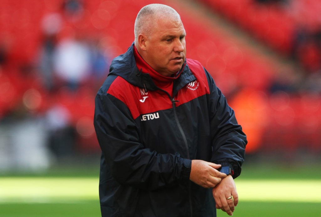 Nigel Gibbs working as an assistant coach for Swansea City