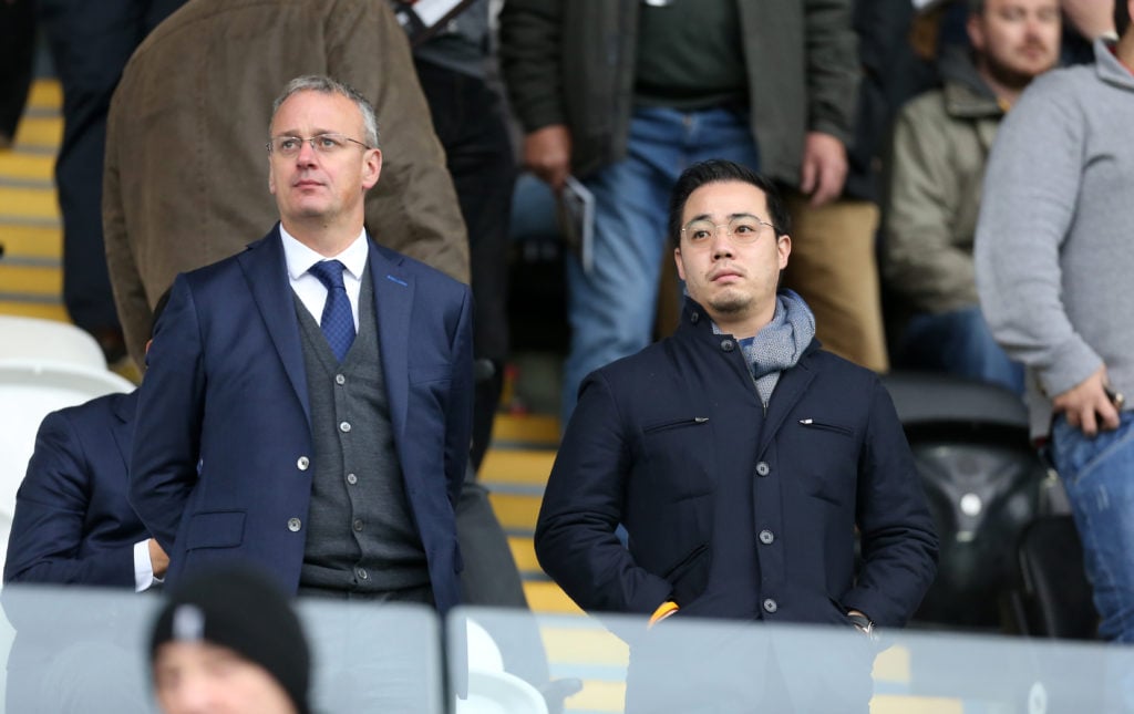 Jon Rudkin watches on with Aiyawatt Srivaddhanaprabha during Leicester City's game against Swansea City