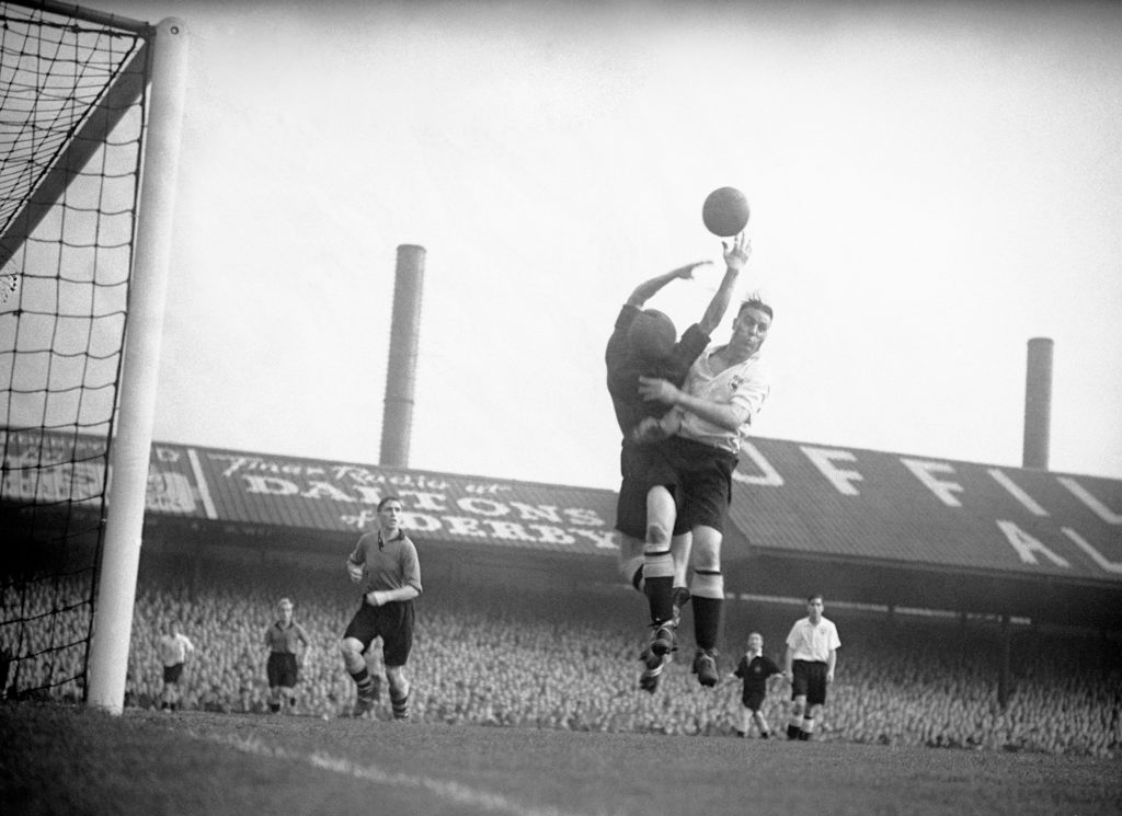 Jack Stamps of Derby County challenges for the ball against Wolves in 1949 at the Baseball Ground