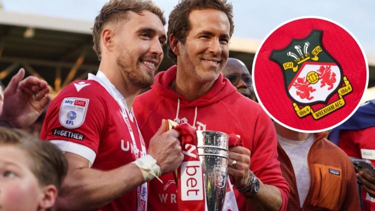 Wrexham striker Sam Smith and Wrexham owner Ryan Reynolds pose for a photo together after Wrexham achieved promotion to the Championship from Leagu...