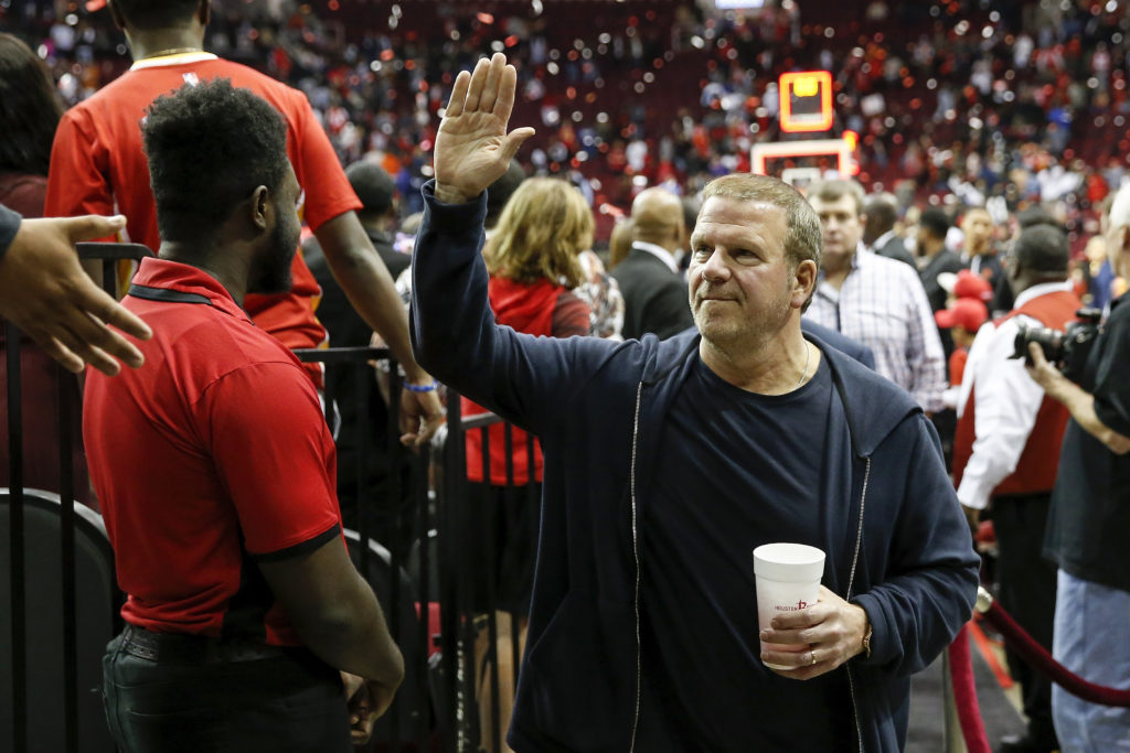 Owner Tilman Fertitta of the Houston Rockets waves to the crowd
