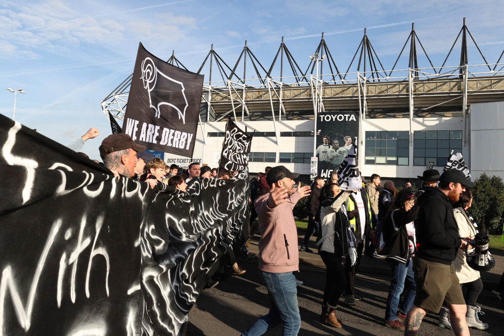 Derby County fans protest against chairman Mel Morris before the Sky Bet Championship match between Derby County and Birmingham City at Pride Park Stadium on January 30, 2022 in Derby, England.
