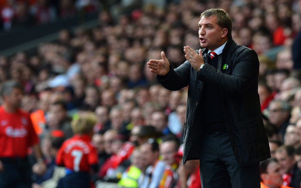 Liverpool manager Brendan Rodgers talks to his players during their English Premier League football match against Reading at Anfield in Liverpool, north-west England on October 20, 2012.