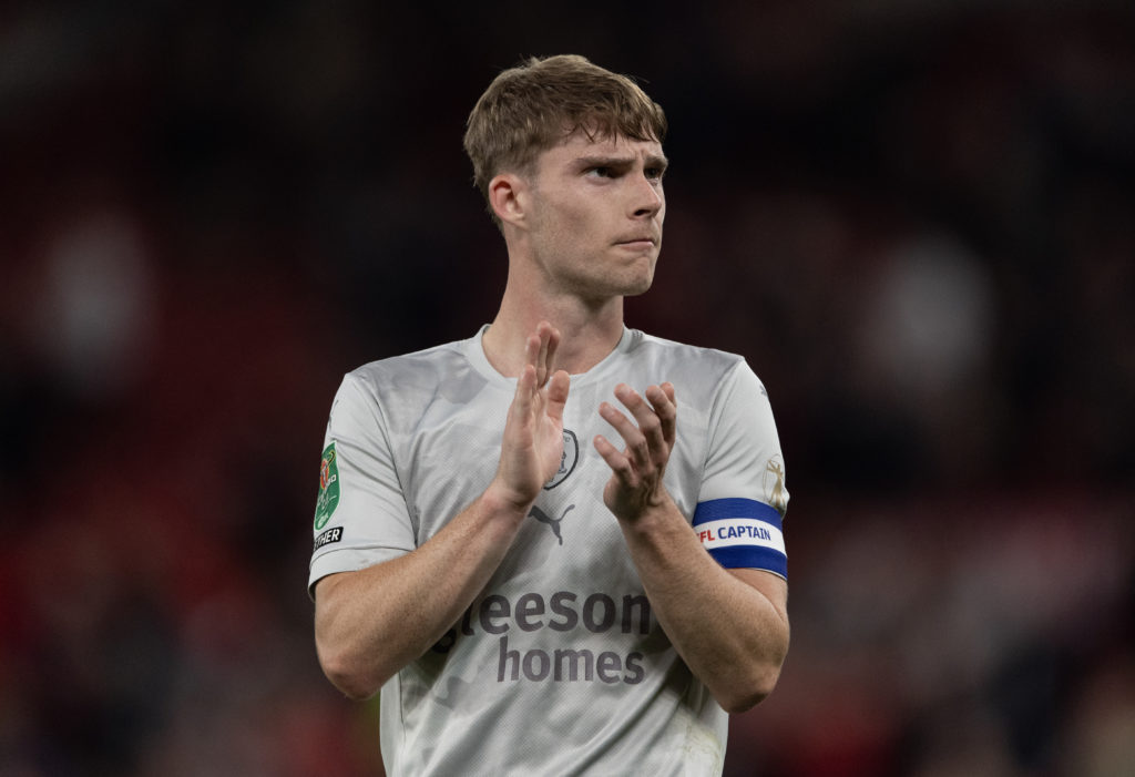 Luca Connell of Barnsley acknowledges the fans after the Carabao Cup Third Round match between Manchester United and Barnsley at Old Trafford