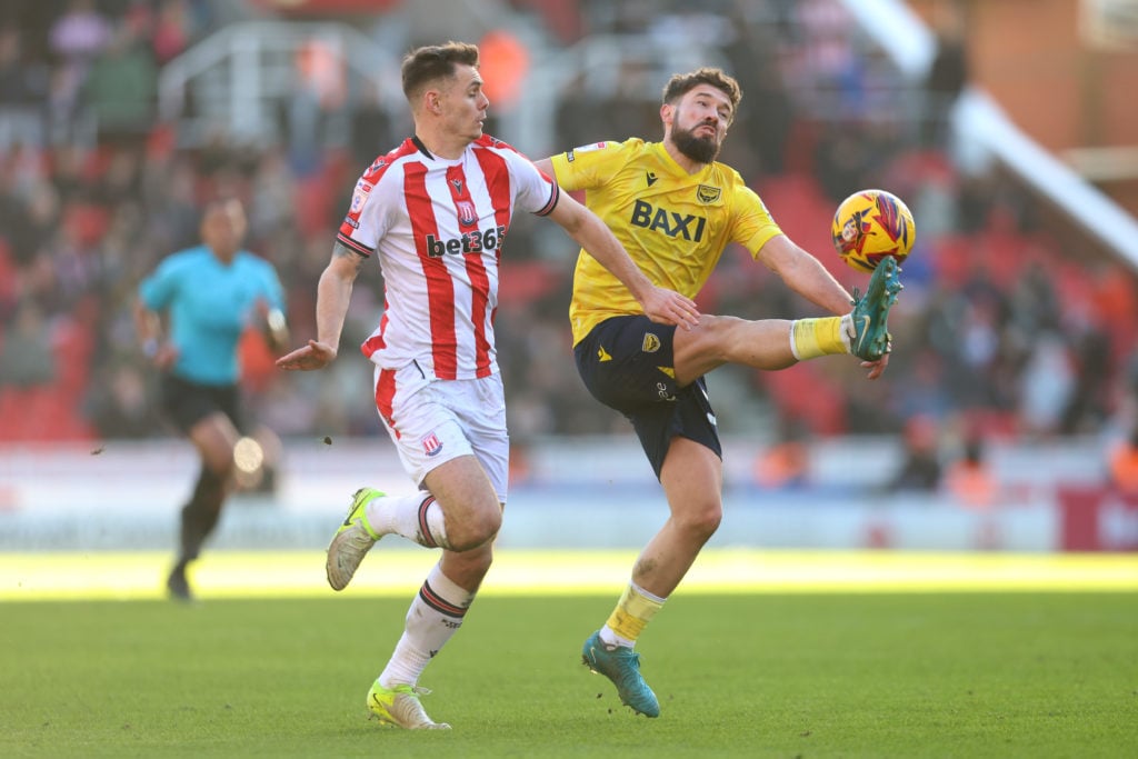 Tom Bradshaw playing for Oxford United against Stoke City