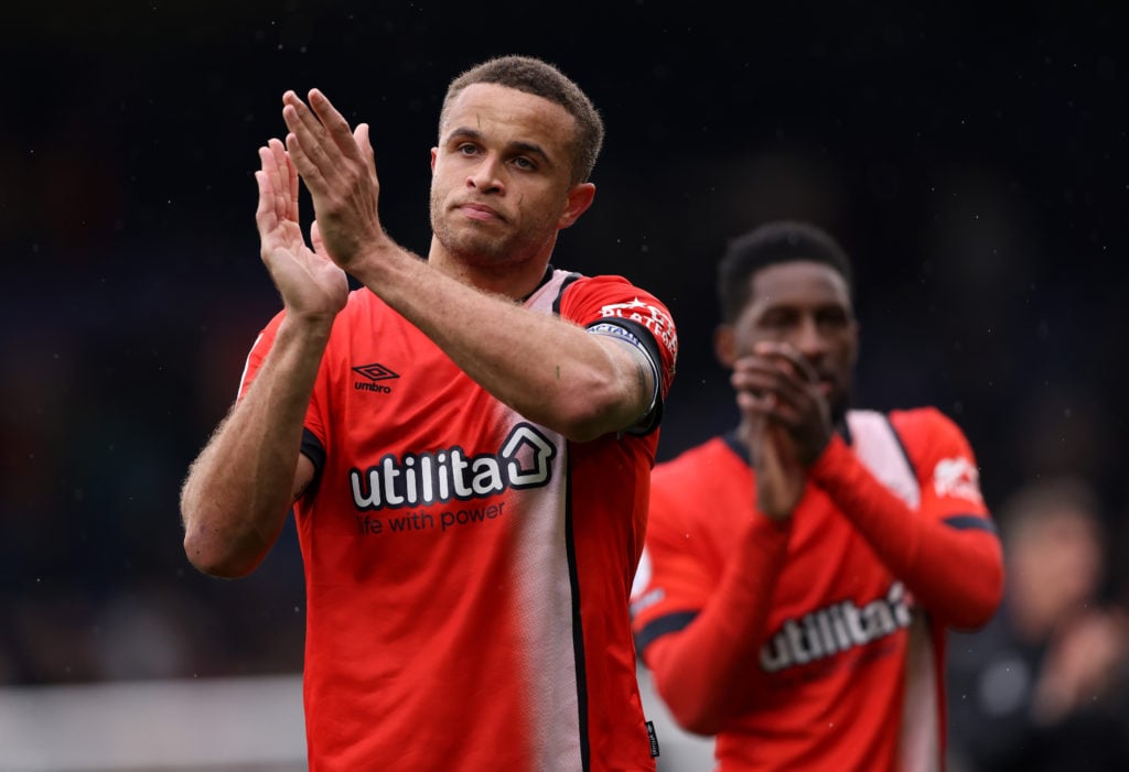 Carlton Morris of Luton Town applauds the fans at full-time following the team's victory in the Sky Bet Championship match between Luton Town FC and Bristol City FC