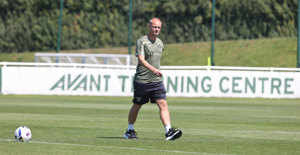 Norwich City manager Liam Manning walks to the dug out during a Behind Closed Doors Friendly Match between Norwich City and Northampton Town