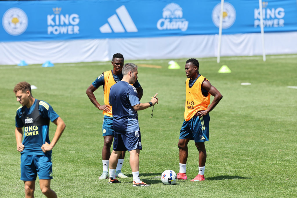 Marti Cifuentes speaks to Abdul Fatawu during Leicester City's pre-season training session