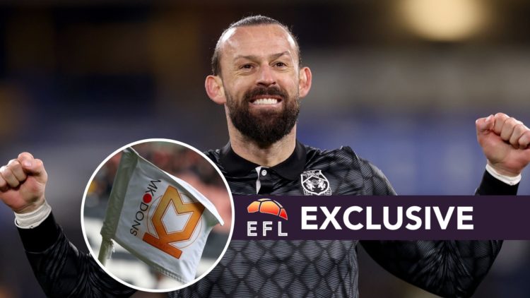 Steven Fletcher of Wrexham AFC during the Sky Bet League One match between Huddersfield Town AFC and Wrexham AFC. Inset, MK Dons badge on a corner ...