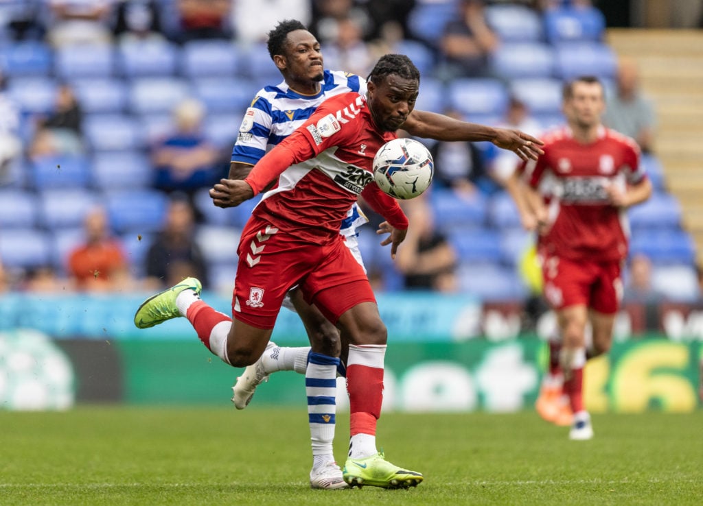 Middlesbrough's Toyosi Olusanya competing with Reading United's Baba Rahman during the Sky Bet Championship match between Reading and Middlesbrough