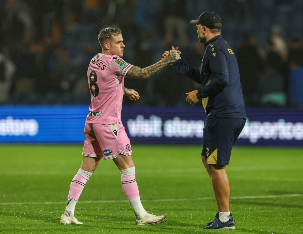 Blackburn Rovers manager John Eustace shake hands with Sammie Szmodics at the end of the match during the Carabao Cup First Round match between Stockport County and Blackburn Rovers