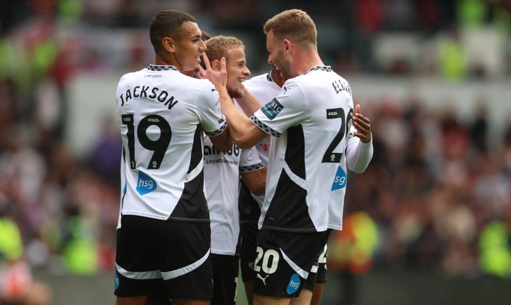 Kenzo Goudmijn of Derby County celebrates with his teammates after he scores their first goal during the Sky Bet Championship match between Derby County FC and Bristol City FC