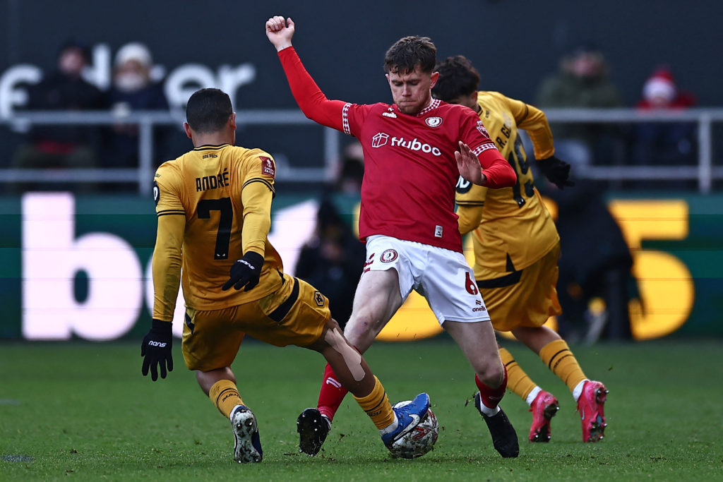 Bristol City's English midfielder #06 Max Bird (C) vies with Wolverhampton Wanderers' Brazilian defender #7 Andre (L) and Wolverhampton Wanderers' Portugese midfielder #19 Rodrigo Gomes (R) during the English FA Cup third round football match between Bristol City and Wolverhampton Wanderers