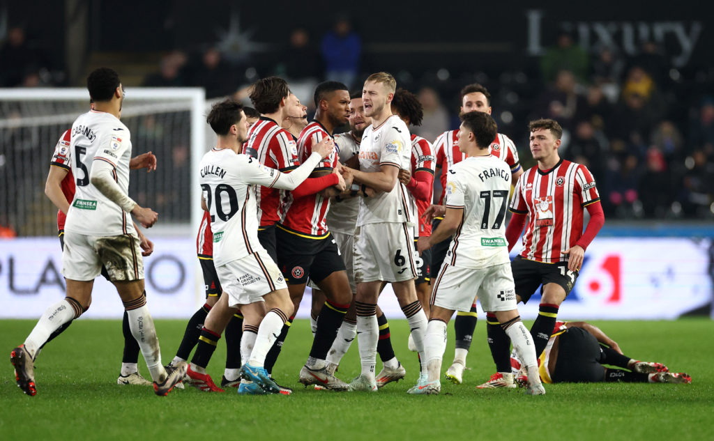 Swansea City and Sheffield United players clash with each other during the Championship fixture