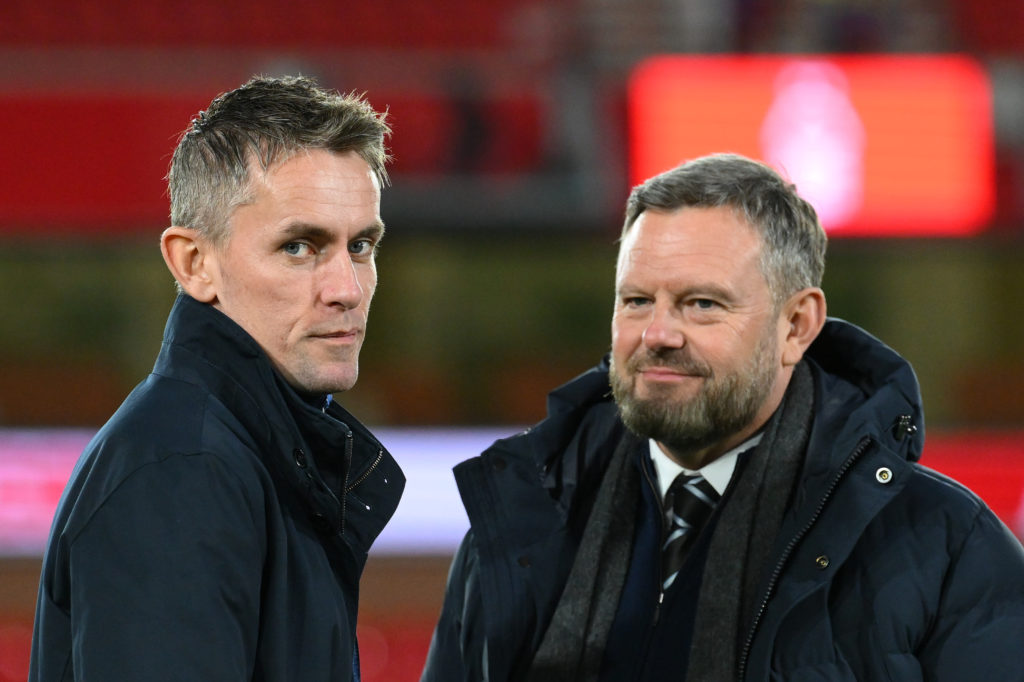 Mark Ashton and Kieran McKenna look on before an Ipswich Town match