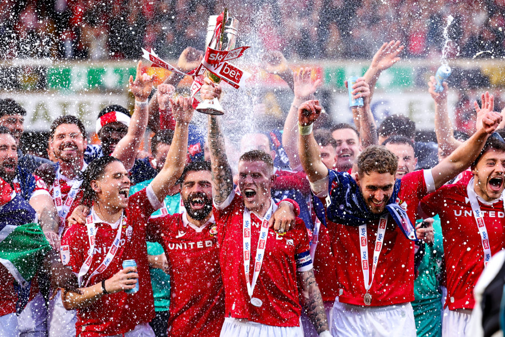 Wrexham AFC celebrate getting promoted after beating Charlton Athletic in League One
