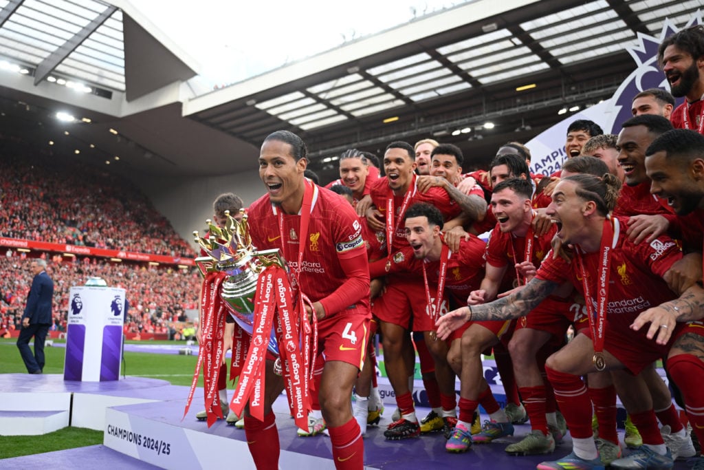 Virgil Van Dijk lifting the Premier League trophy