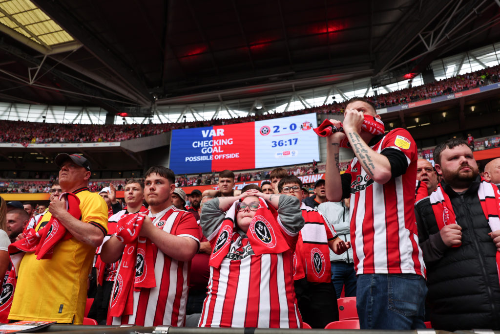 Sheffield United fan looks dejected