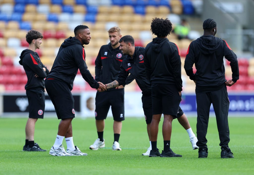 Players of Sheffield United inspect the pitch
