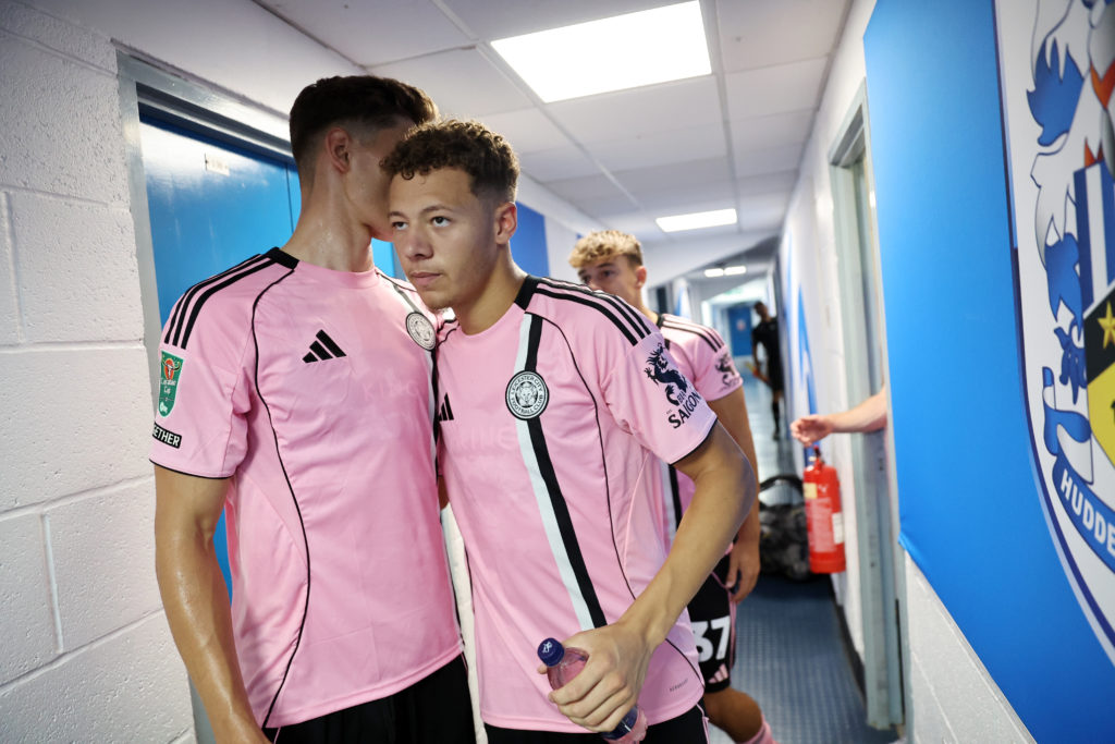 Kasey McAteer and Ben Nelson embrace each other before Huddersfield Town vs Leicester City