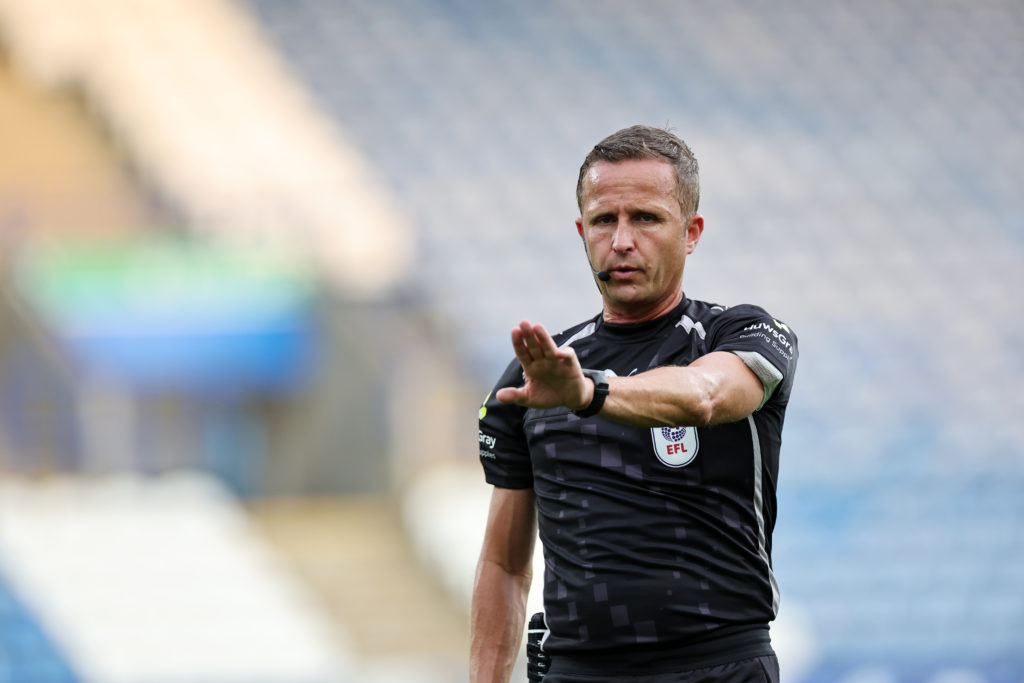 Referee David Webb gestures during the Carabao Cup first round match between Huddersfield Town and Leicester City