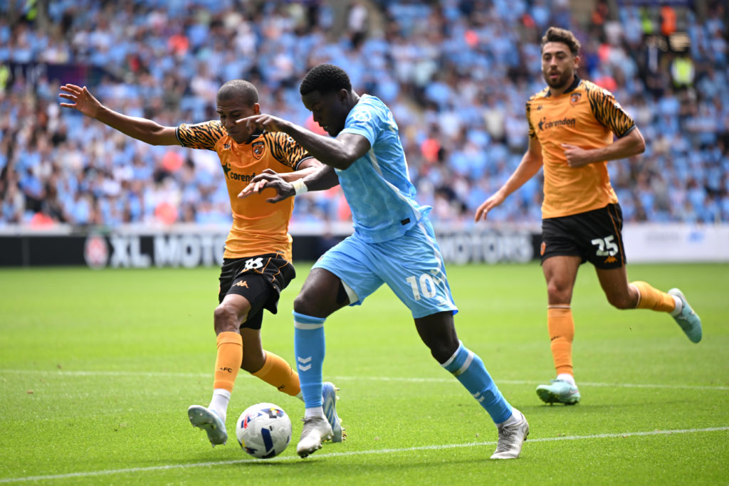 Ephron Mason-Clark of Coventry City is challenged by Cody Drameh of Hull City