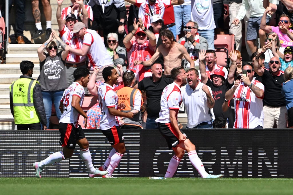 Southampton FC players celebrate after Jack Stephens' winning goal against Wrexham AFC