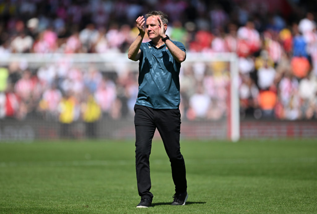 Phil Parkinson applauds the Wrexham fans after losing to Southampton
