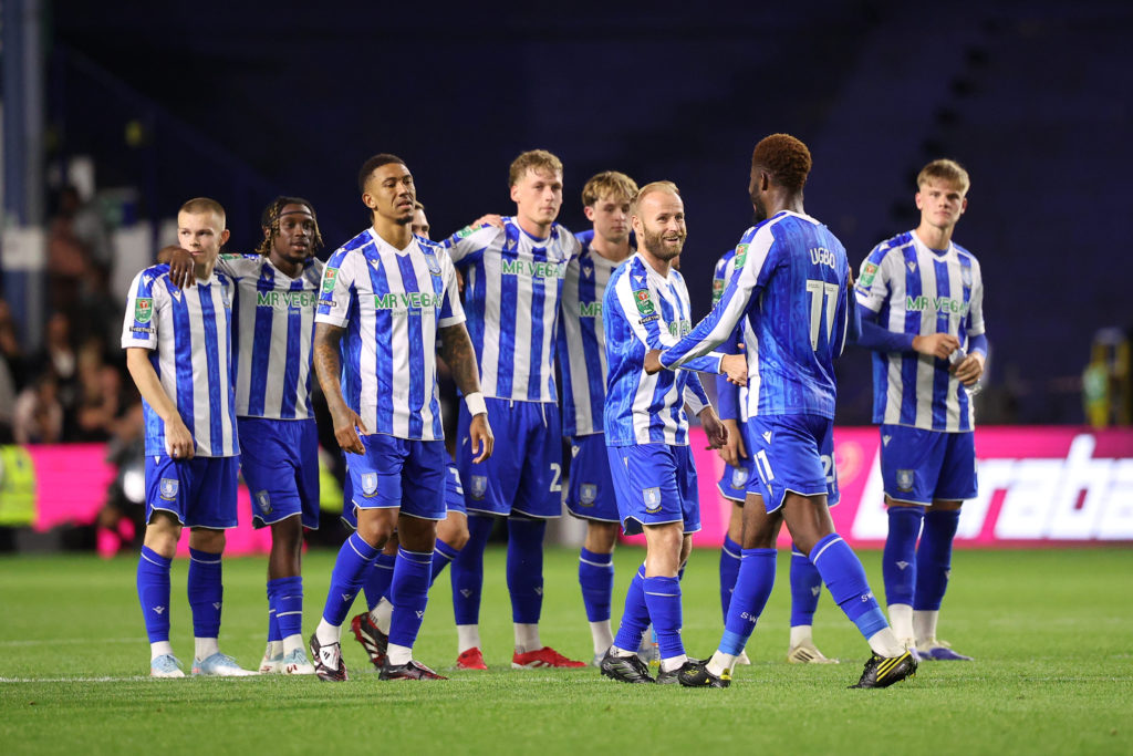 Barry Bannan of Sheffield Wednesday shakes the hand of Ike Ugbo of Sheffield Wednesday