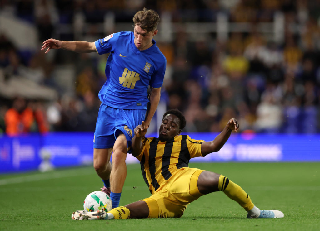 Lewis Koumas of Birmingham City is challenged by Jaheim Headley of Port Vale