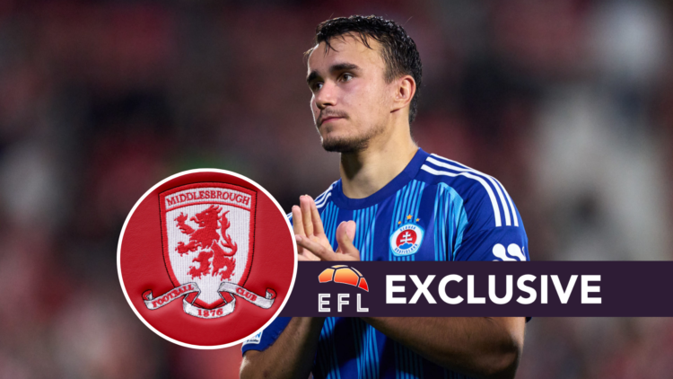 David Strelec of SK Slovan Bratislava applauds the supporters. Middlesbrough logo on the seats in the dugout during the Premier League match betwee...